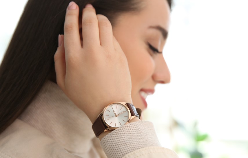 Woman with a watch on her hand wrist. Click to view the new watch range.