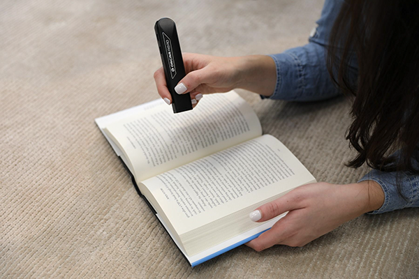 Reading a book with the Orcam Read Smart
