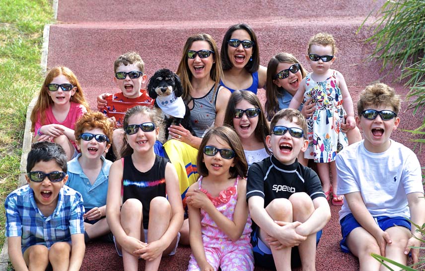 Kids and parents wearing sunglasses outdoors