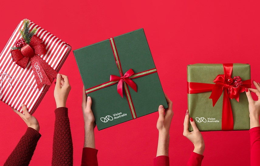 Image of 3 wrapped gifts, being grabbed by 3 pairs of arms. 